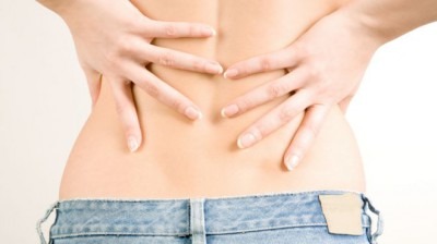 Почему болит внизу спины у женщин